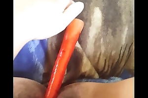Young female using home made sex bagatelle